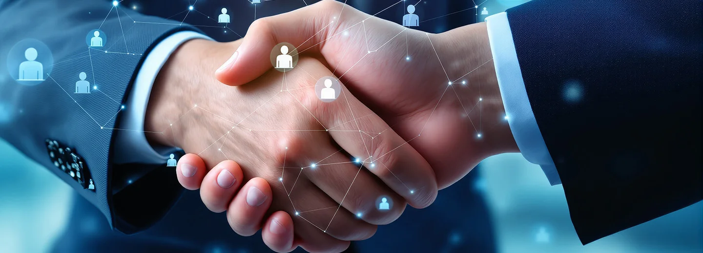 Business-Handschlag vor einem blauen technologischen Hintergrund mit Daten-Grafiken.